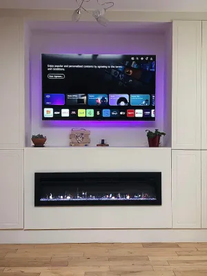 Custom media wall with built-in fireplace in Falkirk